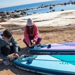Gladiator Pro 10'6 X 32" Paddleboard 2023 -Sup Inflatables sq winter 10 6 11 2 putting leash on